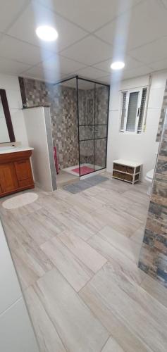 a room with a large room with a stone wall at Villa le Locle in Alicante