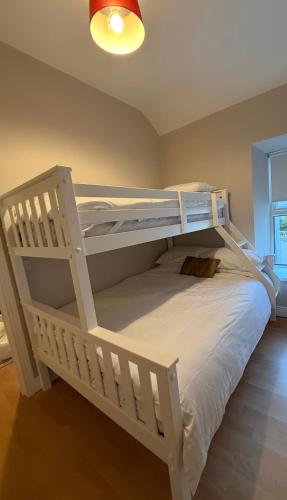a white bunk bed in a room at Derry City Centre Townhouse in Derry Londonderry