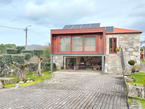 a house with solar panels on top of it at Casa de Santa Luzia B in Caminha