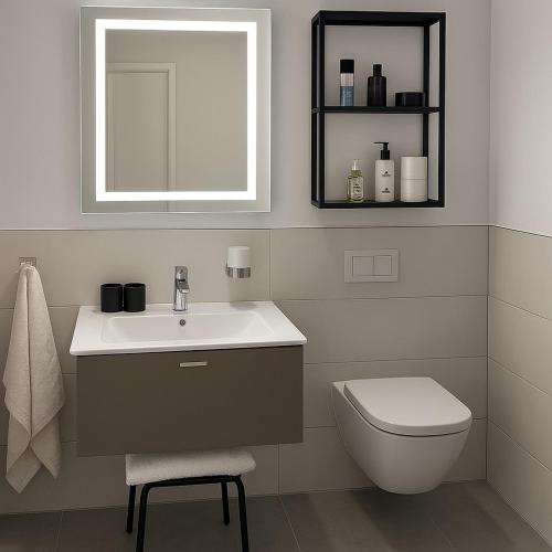 a bathroom with a sink and a toilet and a mirror at Apartment Montabaur Heiligenroth in Heiligenroth