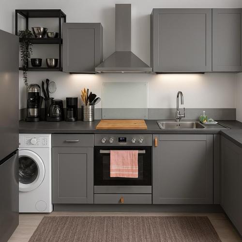 a kitchen with a sink and a stove top oven at Apartment Montabaur Heiligenroth in Heiligenroth