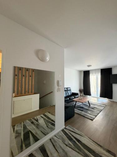 a living room with a couch and a table at Ruhige Wohnung in Linz