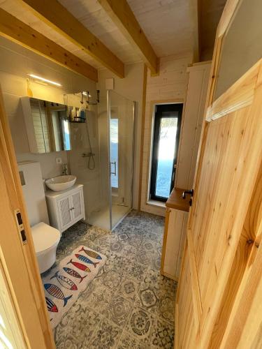 a bathroom with a toilet and a sink and a shower at Gawra Pogórze in Jawornik Polski