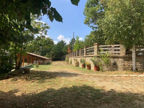 a brick building with trees in the background at Peaceful Mountain Retreat - private guest house in Gorreta