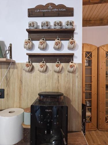 a coffee shop with shoes on a wall at Casa Delia in Balta