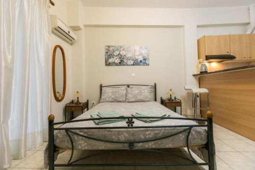 a bedroom with a bed in a room at Central Cozy Apartment 4 in Sparta