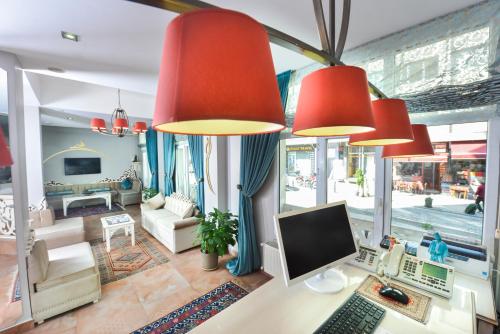 a living room filled with furniture and a tv at Adamar Hotel-Special Category in Istanbul