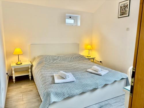 Llit o llits en una habitació de Apartments Mare