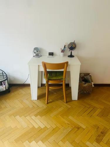 a white desk with a chair in a room at Pit-Stop 2 in Monza