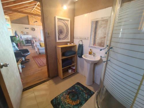 a small bathroom with a sink and a toilet at Casa La Virgen in Burro Muerto
