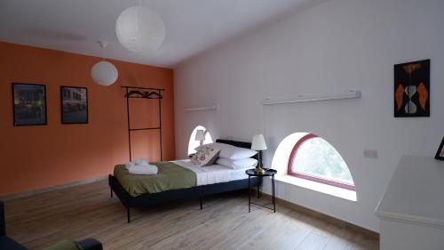a bedroom with a bed with an arched window at Peprina Apt 2 in Central Rabat in Rabat
