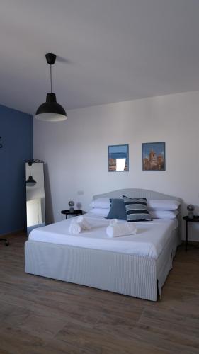 a bedroom with a large white bed in a room at Peprina Penthouse in Central Rabat in Rabat