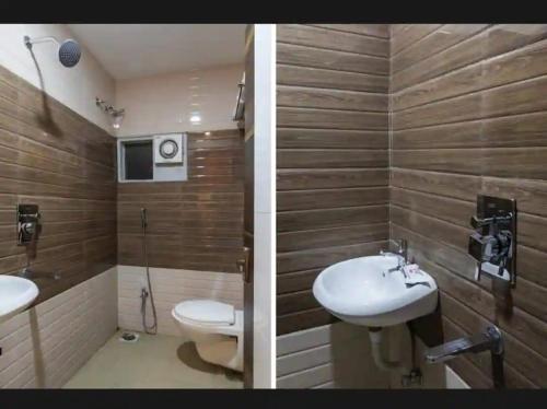 a bathroom with a toilet and a sink and a toilet at Samarth guest house in Indore