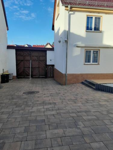 a large parking lot with a building and a garage at Appartment Annika in Hochheim