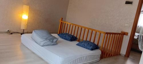 a white couch with two pillows on it in a room at Alyakek Apartment in Istanbul