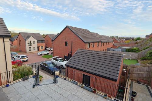 an aerial view of a house with a parking lot at 6 Bedroom Cardiff Stylist Home - 4 Free Private Parking - Ideal for Family & Contractors in Cardiff