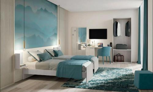 a bedroom with a bed and a desk at Urban Stay Siena in Siena