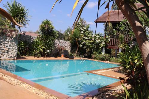 a swimming pool in the middle of a resort at Clear Water Pool Villa in Mu Si