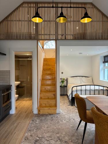 a room with a staircase leading to a bedroom at Stable Lodge in Killarney