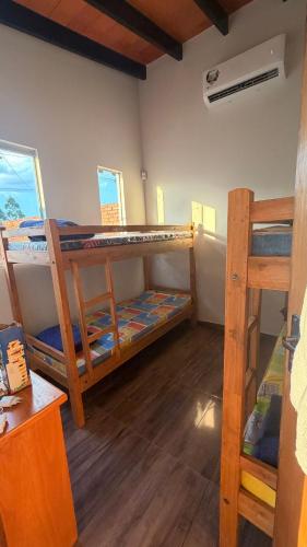 a room with two bunk beds in a room at La casita de Ivanna in San Bernardino