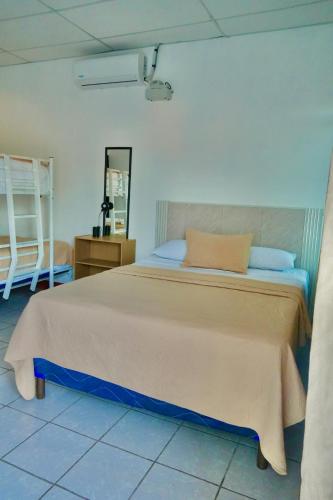 a bedroom with a large bed in a room at Casa Belén in Flores