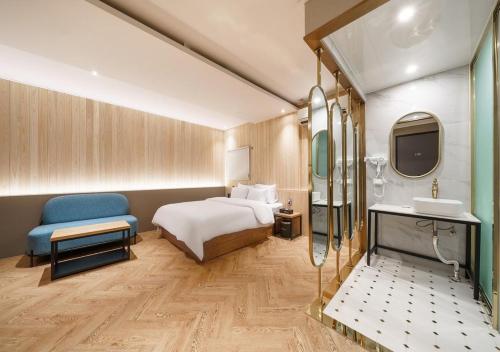 a hotel room with a bed and a sink at No25 Doksan Intersection in Seoul