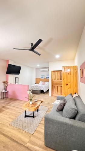 a living room with a couch and a table at GZ Suites in Coco