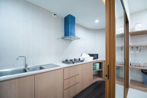 a kitchen with a sink and a counter top at Villa LaMoon in Sattahip