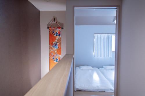 a room with a door leading to a bedroom at 三十三 和華waka in Kyoto