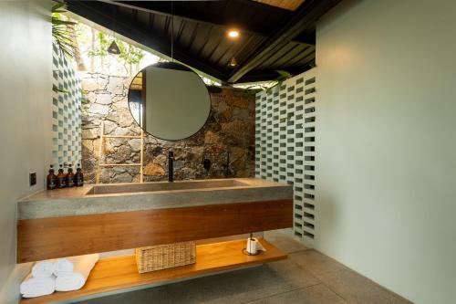 a bathroom with a sink and a mirror at The Sevana in Talalla South