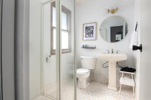 a bathroom with a toilet and a sink at Lumber Jill Lodge in Balsam Lake