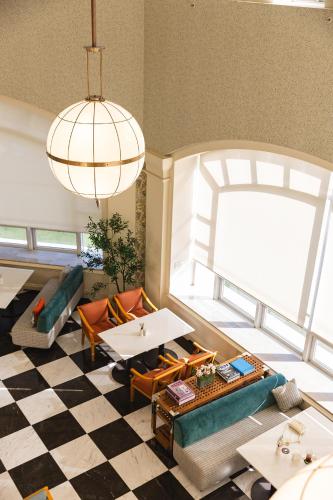 a living room with a checkered floor at La Vie Dor Hotel and Resort, Trademark Collection by Wyndham in Hwaseong