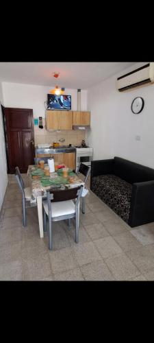 a living room with a table and a couch at Alquileres BH in La Rioja