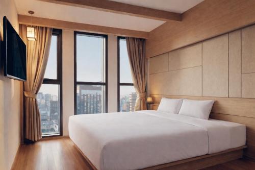 Llit o llits en una habitació de Hotel POCO Seongsu