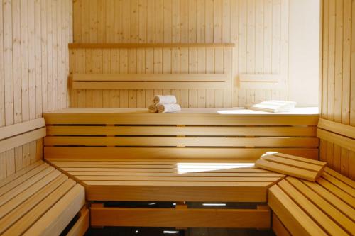 a sauna with a teddy bear sitting in it at Chester Hotel Heidelberg in Heidelberg
