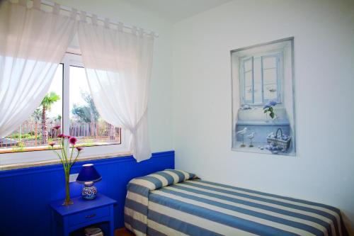 Katil atau katil-katil dalam bilik di Residence Dei Margi