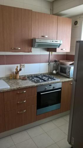 Кухня или мини-кухня в Residence Ghassen
