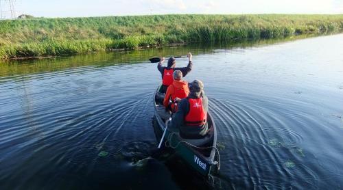 a group of people in a canoe on the water at Fourwinds B&B in March