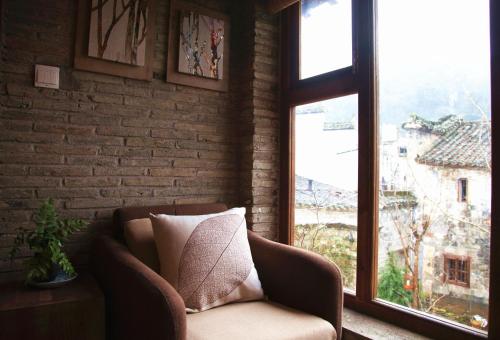 WuYuan QiYe YanXiang Guesthouseにあるシーティングエリア