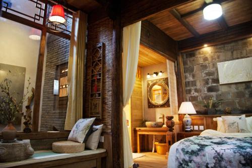 WuYuan QiYe YanXiang Guesthouseにあるベッド
