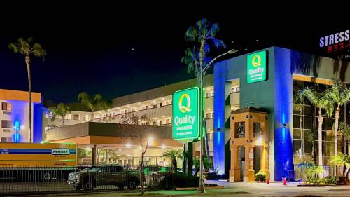 a building with blue lights in front of it at Quality Inn & Suites Los Angeles Airport - Stadium District in Inglewood