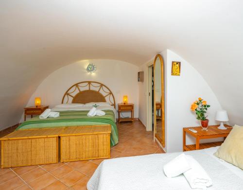 a bedroom with two beds in a room at La Casa Dei Venti in Amalfi