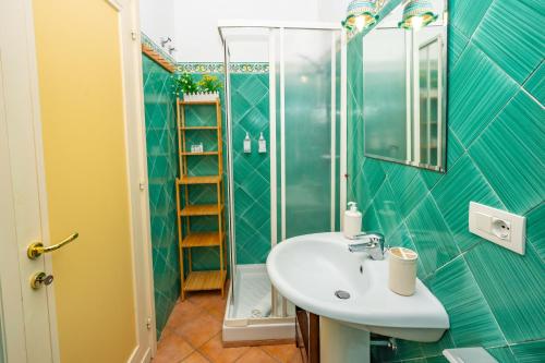 a bathroom with a sink and a shower at La Casa Dei Venti in Amalfi