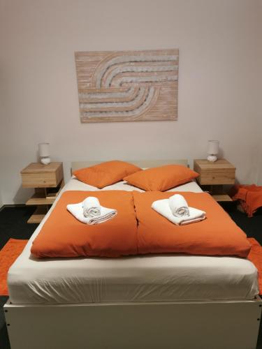 a bedroom with a bed with two towels on it at Ludberga in Ludbreg
