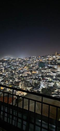 a view of a city at night at Aizawl View Hotel in Āīzawl