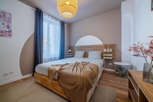 a bedroom with a bed and a large window at Disney 12 min - Gare 5min à pied - Self check-in in Esbly