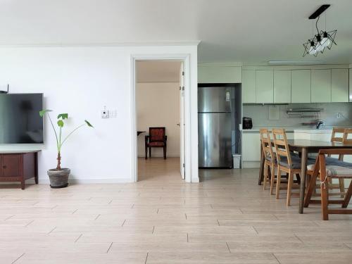 a kitchen and dining room with a table and chairs at 대전 SJ Haus in Daejeon