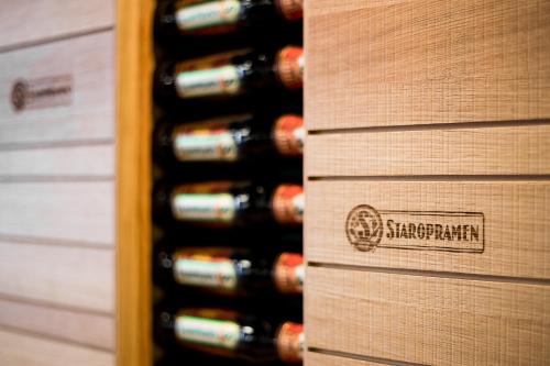 a row of wine bottles in a wine cellar at Hotel Concertino Zlatá Husa in Jindrichuv Hradec