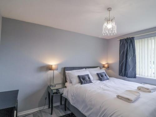 a bedroom with a large white bed with two pillows at Zadena in Bath