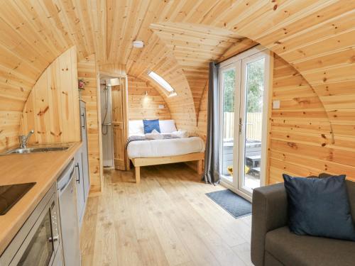 a kitchen and living room of a tiny house at Oak View in Rhayader